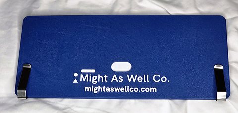 The back of the Wolf Pack holder, navy with the Might As Well Co. mark and web address, and the two visor clips.